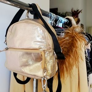 Brand new gold bag with tag still attached. Multi uses.